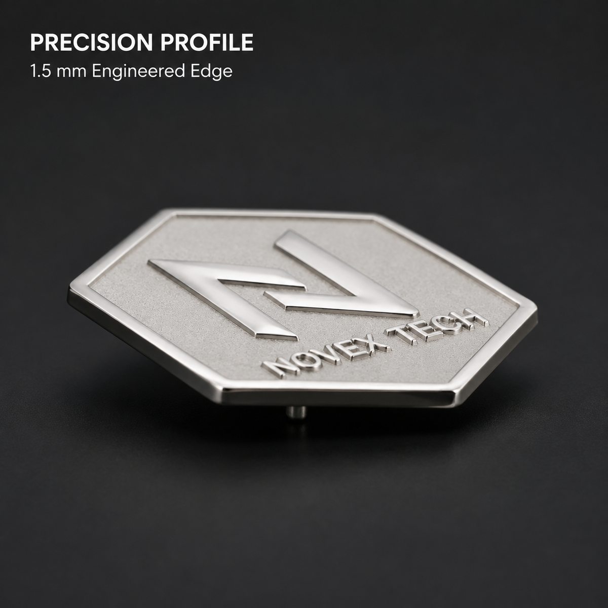 Angled view of a custom brass lapel pin with polished raised logo and matte background