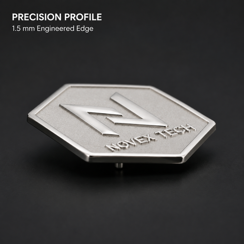 Angled view of a custom brass lapel pin with polished raised logo and matte background